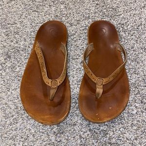 Women’s Olukai orthopedic arch support sandals.